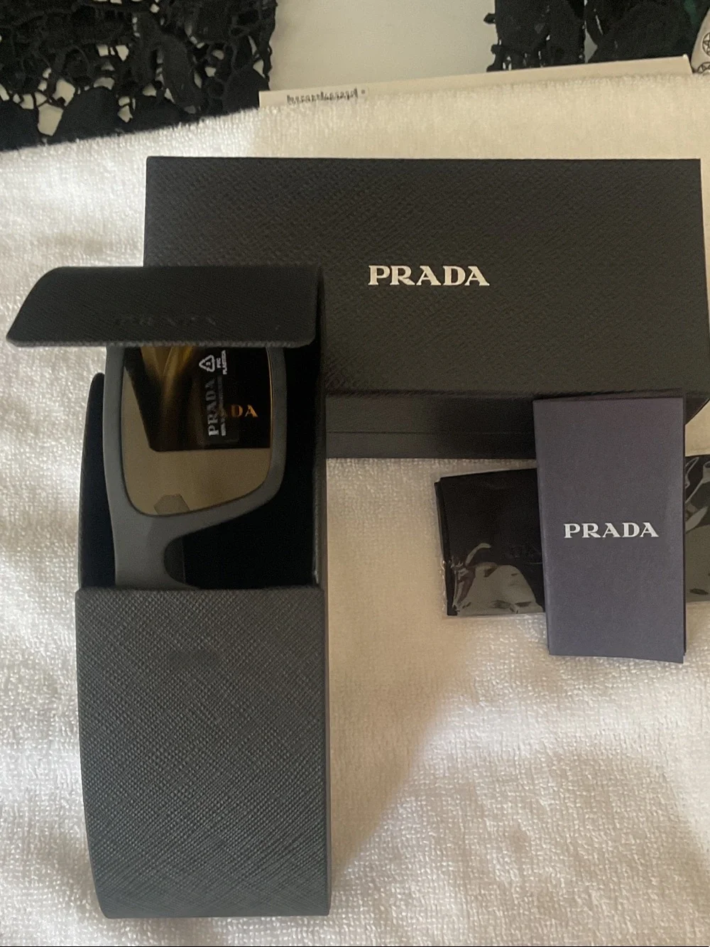 Prada Matte Black Rectangular Sunglasses with Amber Lenses